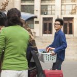 Family helping college kid move into his dorm