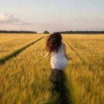 Woman running in an open field