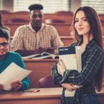 A group of students in a university classroom