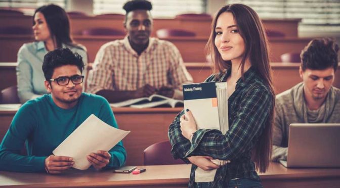 A group of students in a university classroom