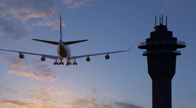 An airplane mid flight flying near an air traffic control center.