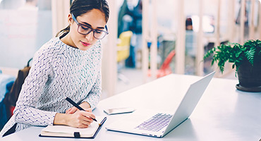 Woman studying on laptop