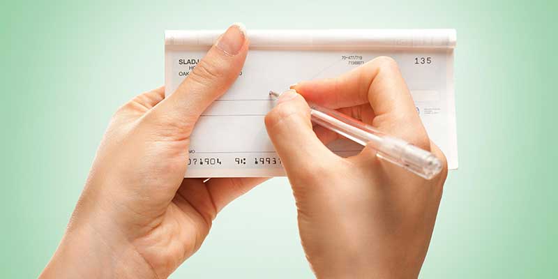 a person writing a check