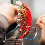 a student practicing electrician work